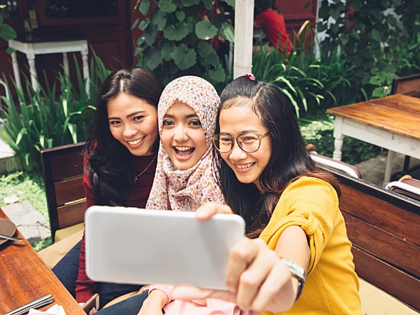 Teenagers taking selfie